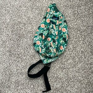 Kavu sling backpack. Very well loved! But would clean easily 🤩😃